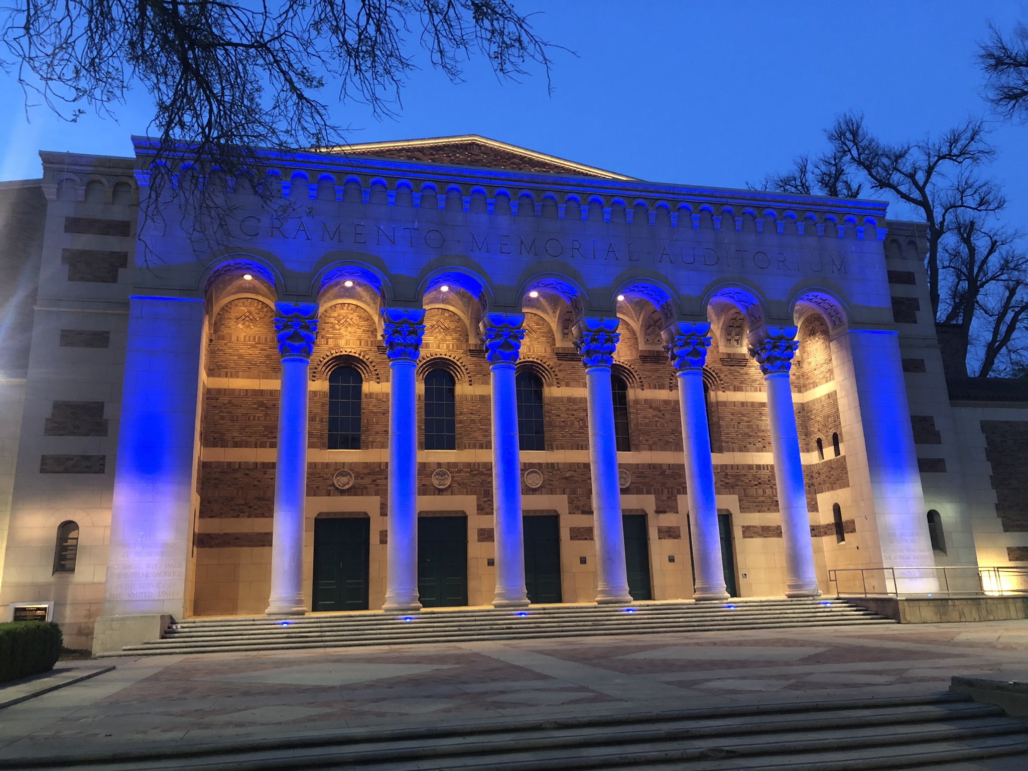 Sacramento Memorial Auditorium lit up in blue